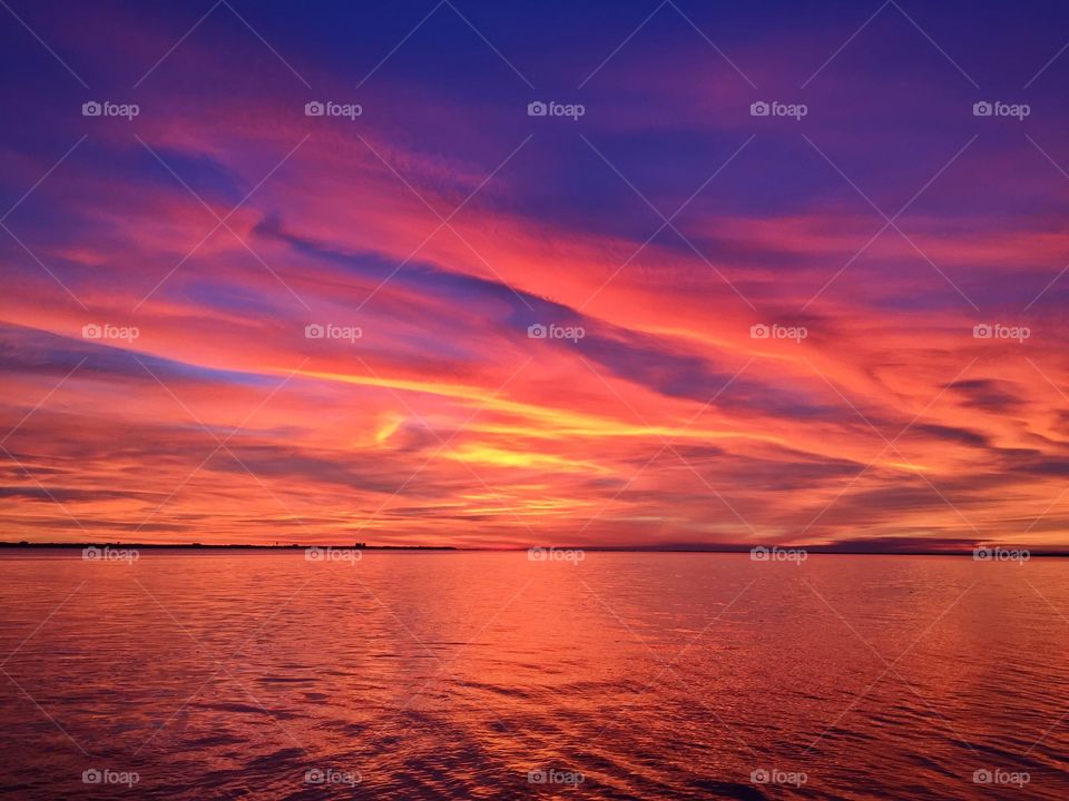 
Ending of the day is most beautiful - Bright streaks of red, pink, and orange slowly overcame the dark blue and purple of the twilight sky. The sky resembled a prism; all the colors blended perfectly into each other