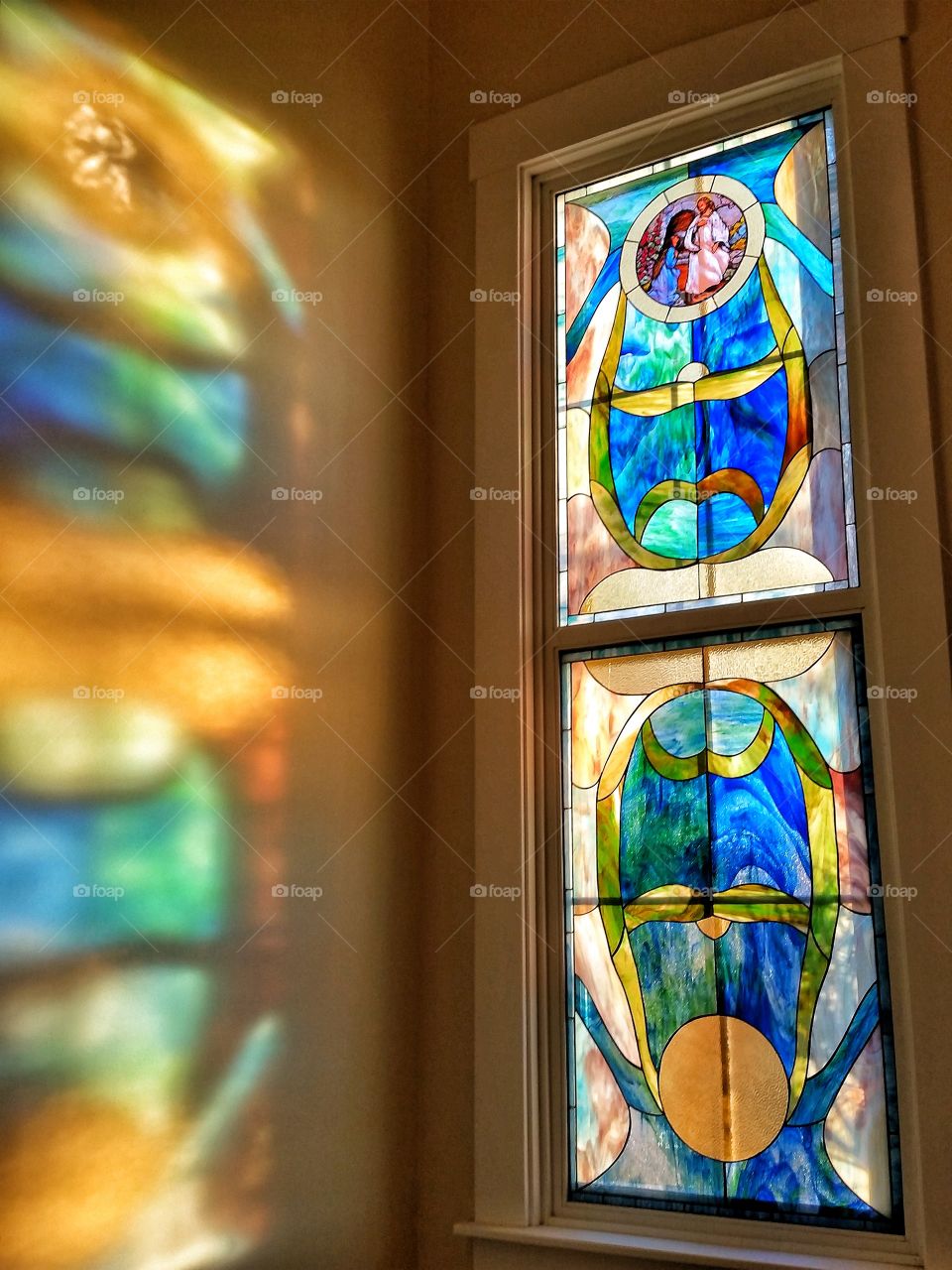 Sun shining through a stained glass window.
