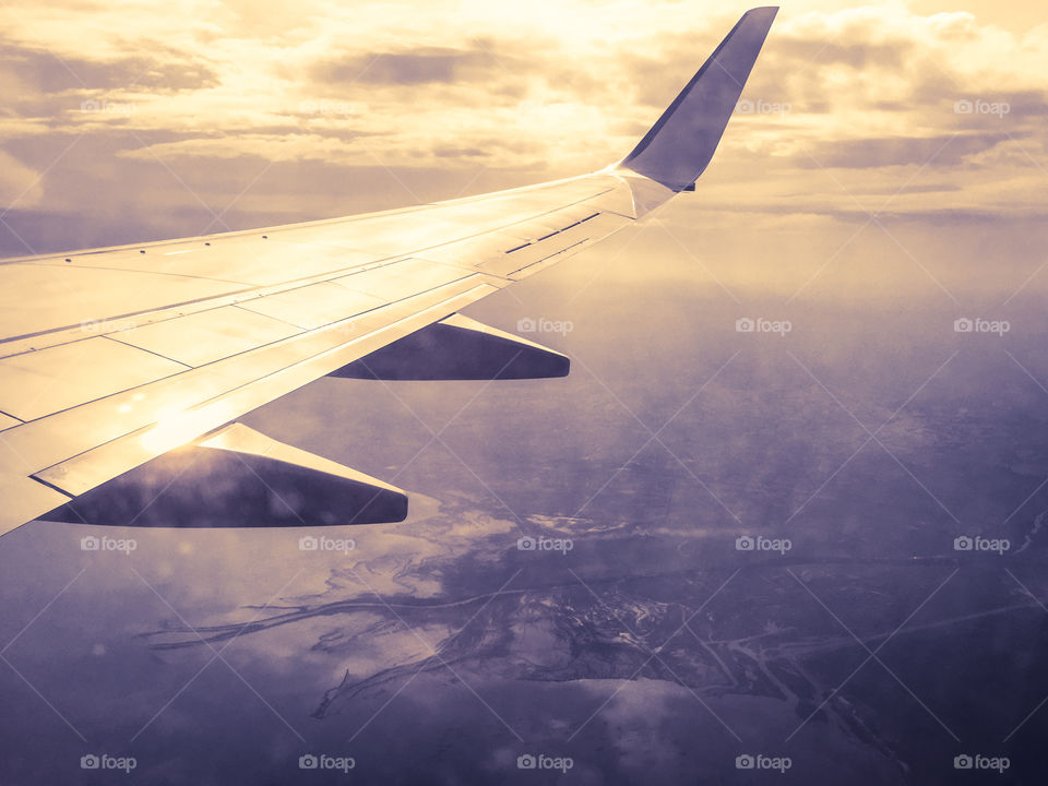 Aircraft wing in sky