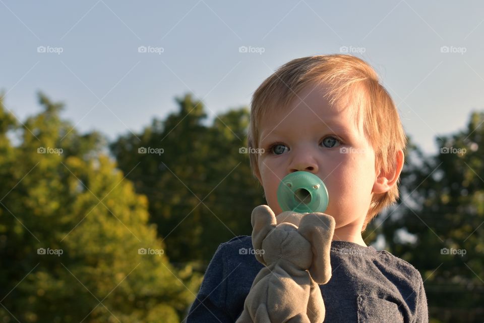 Cute baby boy with pacifier