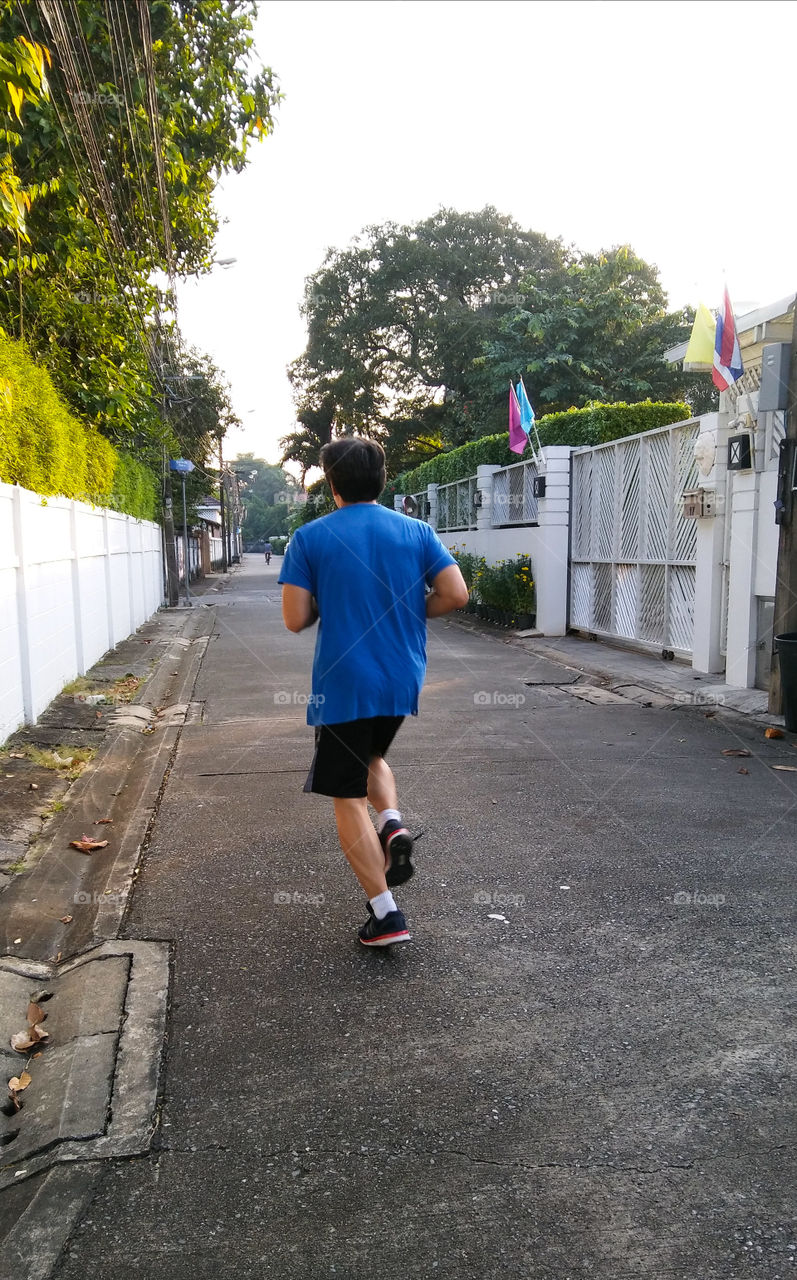 Jogging along the alley near my home.