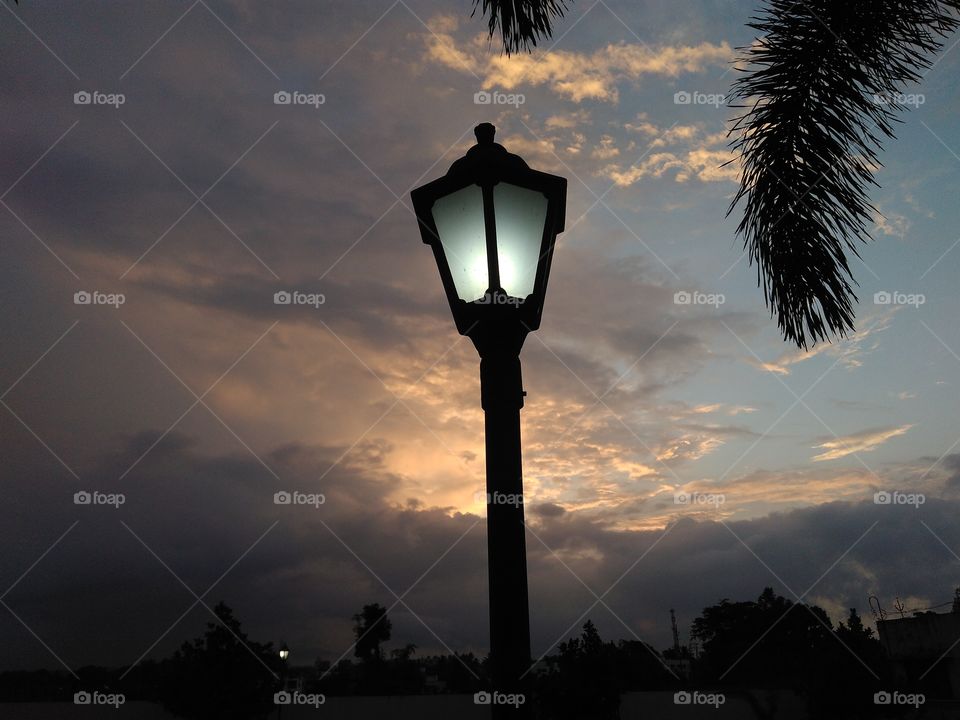 Artificial light is generated by artificial sources, such as street lamps, and natural light is the light generated naturally. The most common source of natural light on Earth is the Sun.