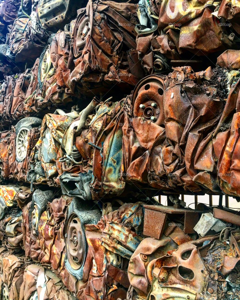 Wall made out of recycled crushed cars 