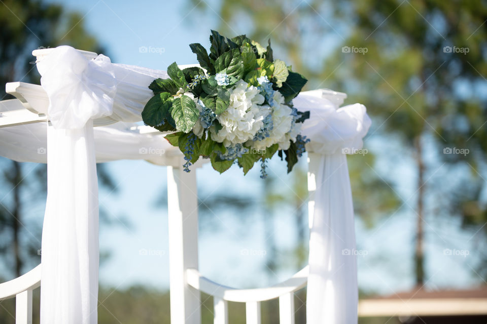 White Arbor Wedding Arch With Hydrangeas