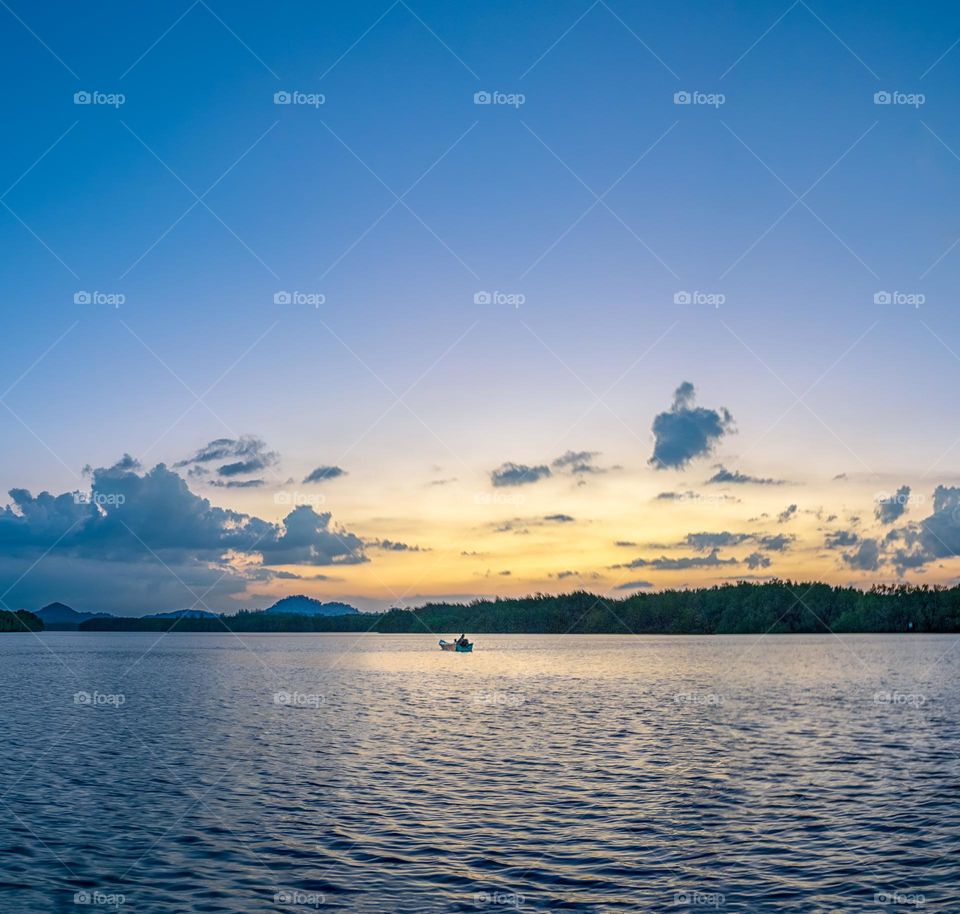 Boat and sea in sunset moment