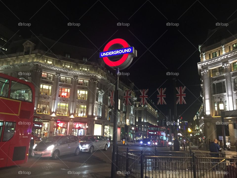 London Underground sign at night