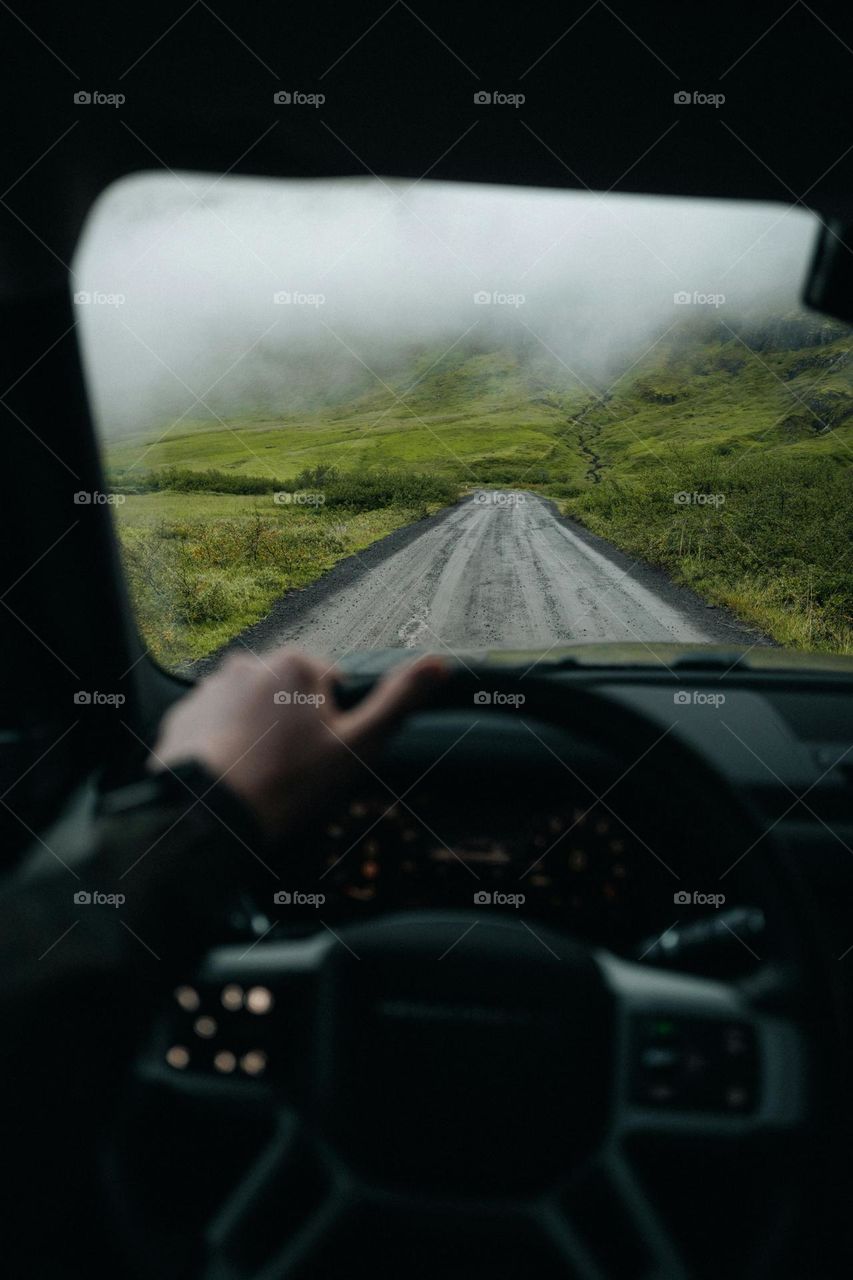 A person driving a car down a rural road

Enjoy the journey