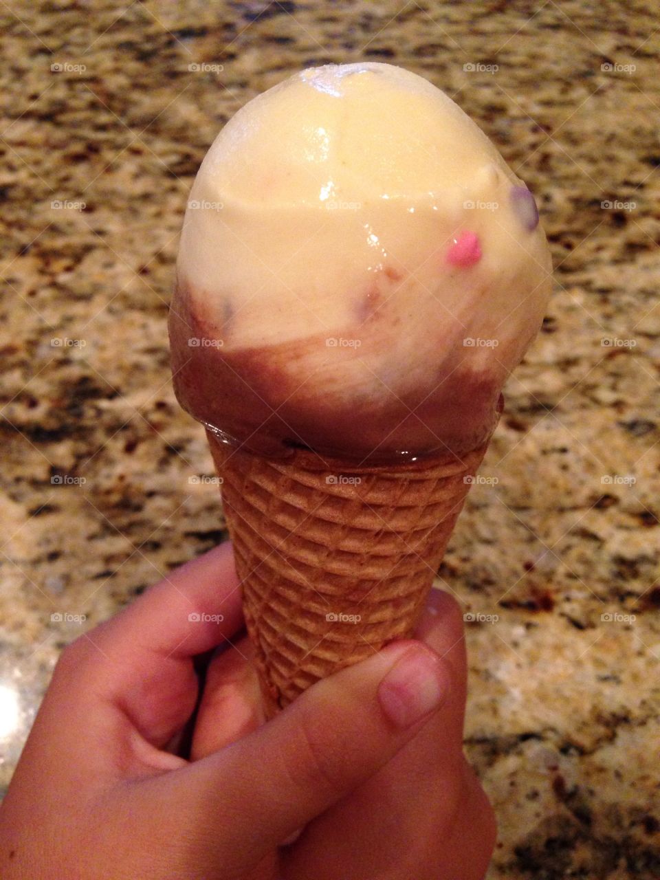 Smooth and sweet. Girl holding ice cream cone