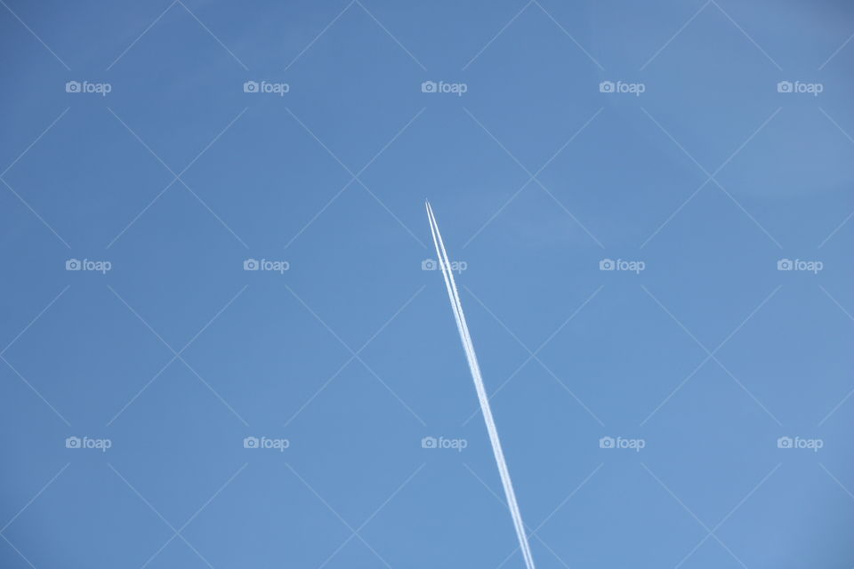 Plane leaving mark on a blue sky 