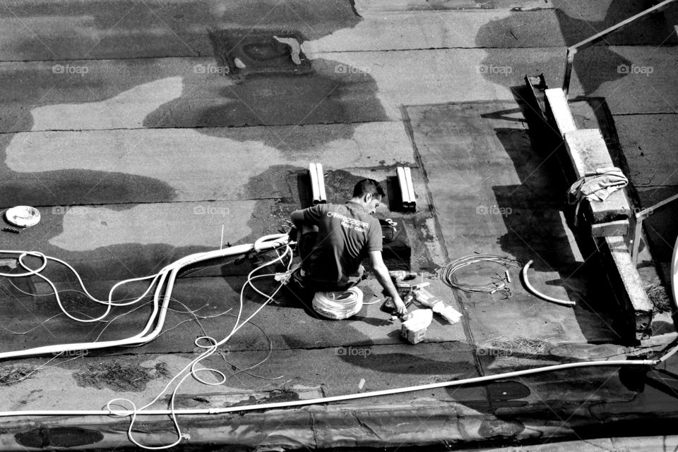 a man working on the roof