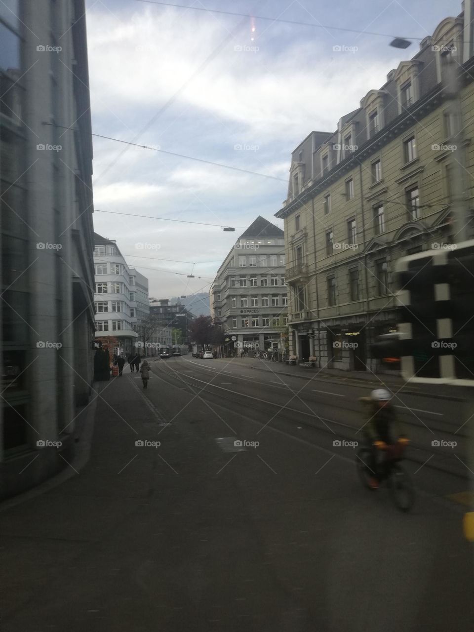 A photo taken inside a moving bus in the roads of Strasbourg, France. This shot is capturing the fast pace of life but also the peace of citizen's daily routine.