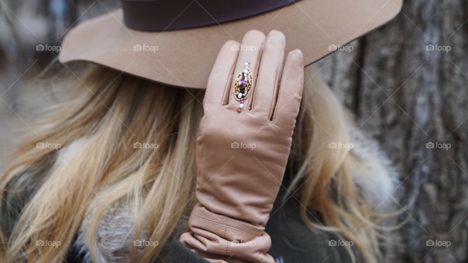 A woman wearing leather gloves