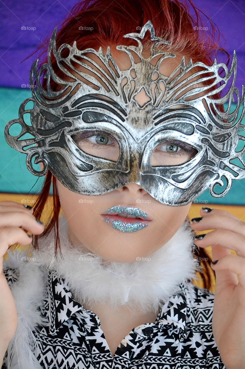 Woman with mask and glitter lipstick