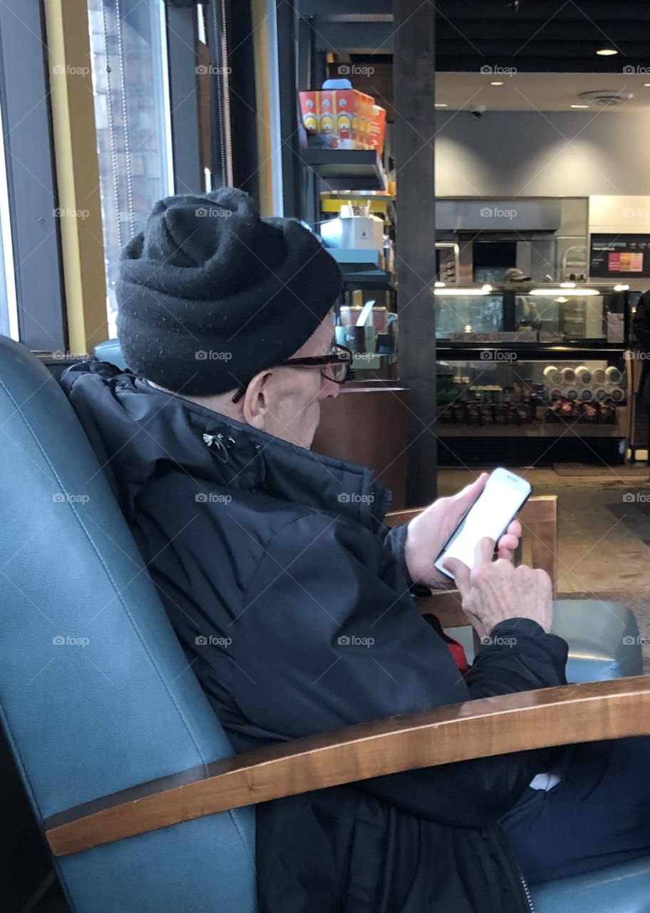Elderly Man with his Phone
