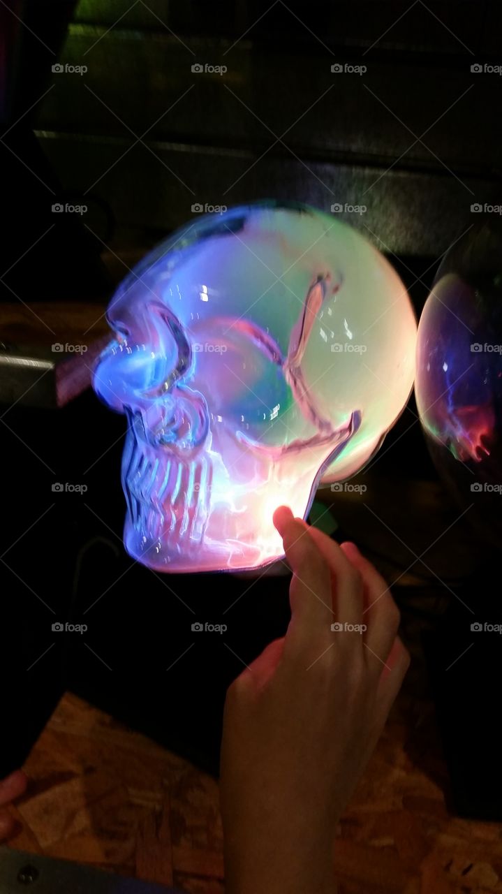Glowing skull.. daughter touching skull.