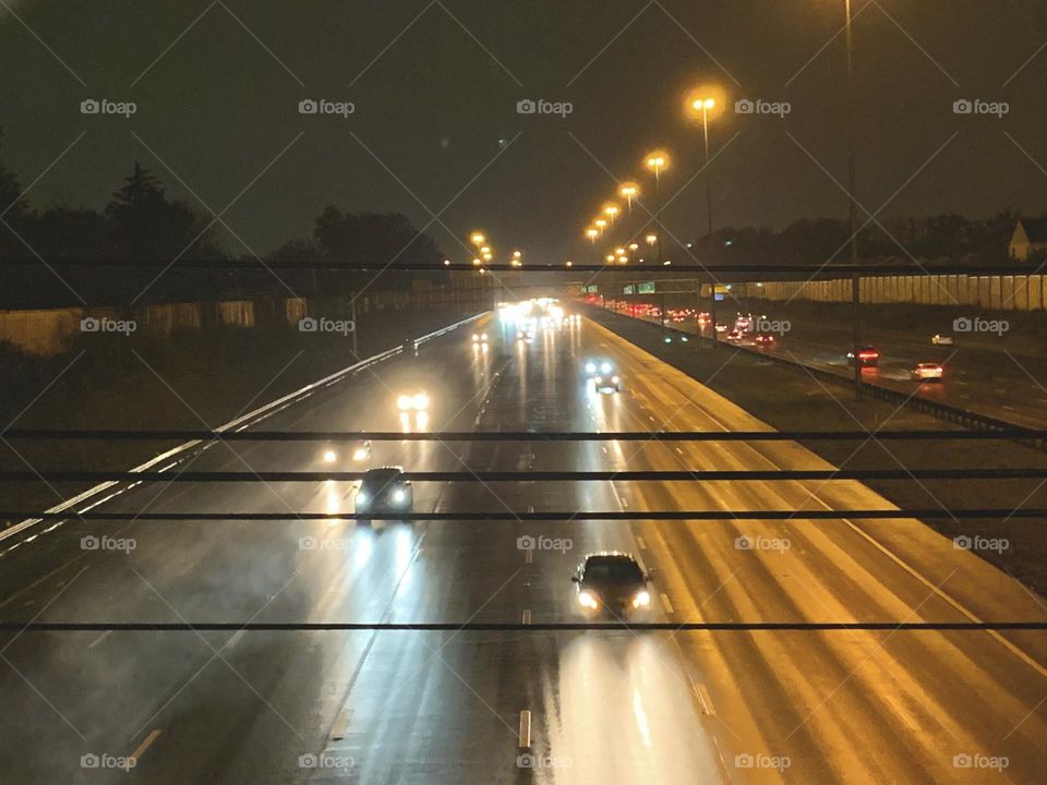 A look down onto the Highway, from a local overpass. It’s 6:30 in the evening, in a rainy Midwest town. 