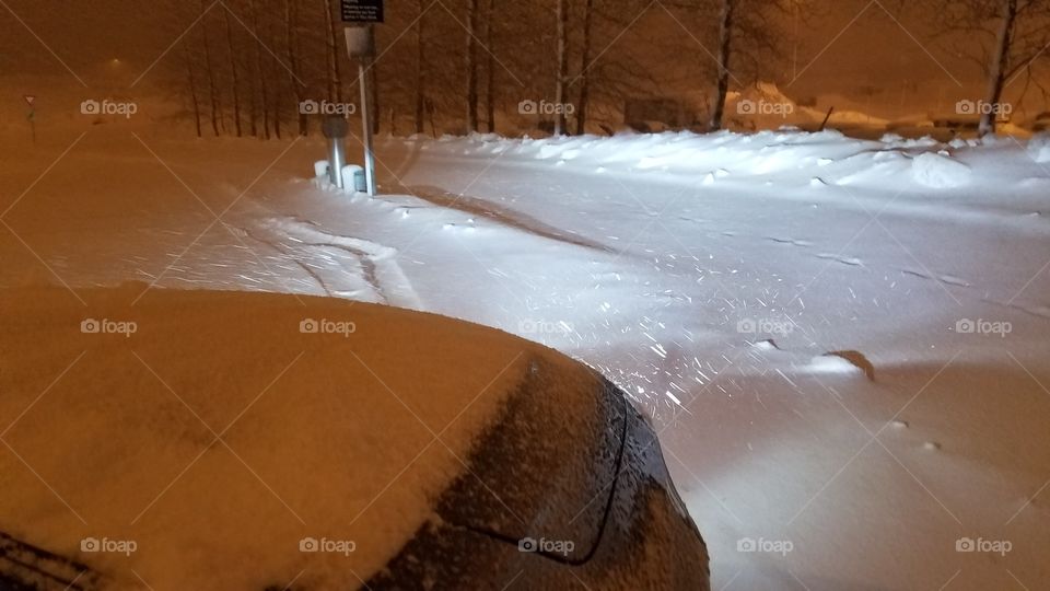 Driving at night on the snowy blizzard