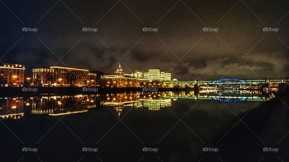 Lights of the night city reflected in the water