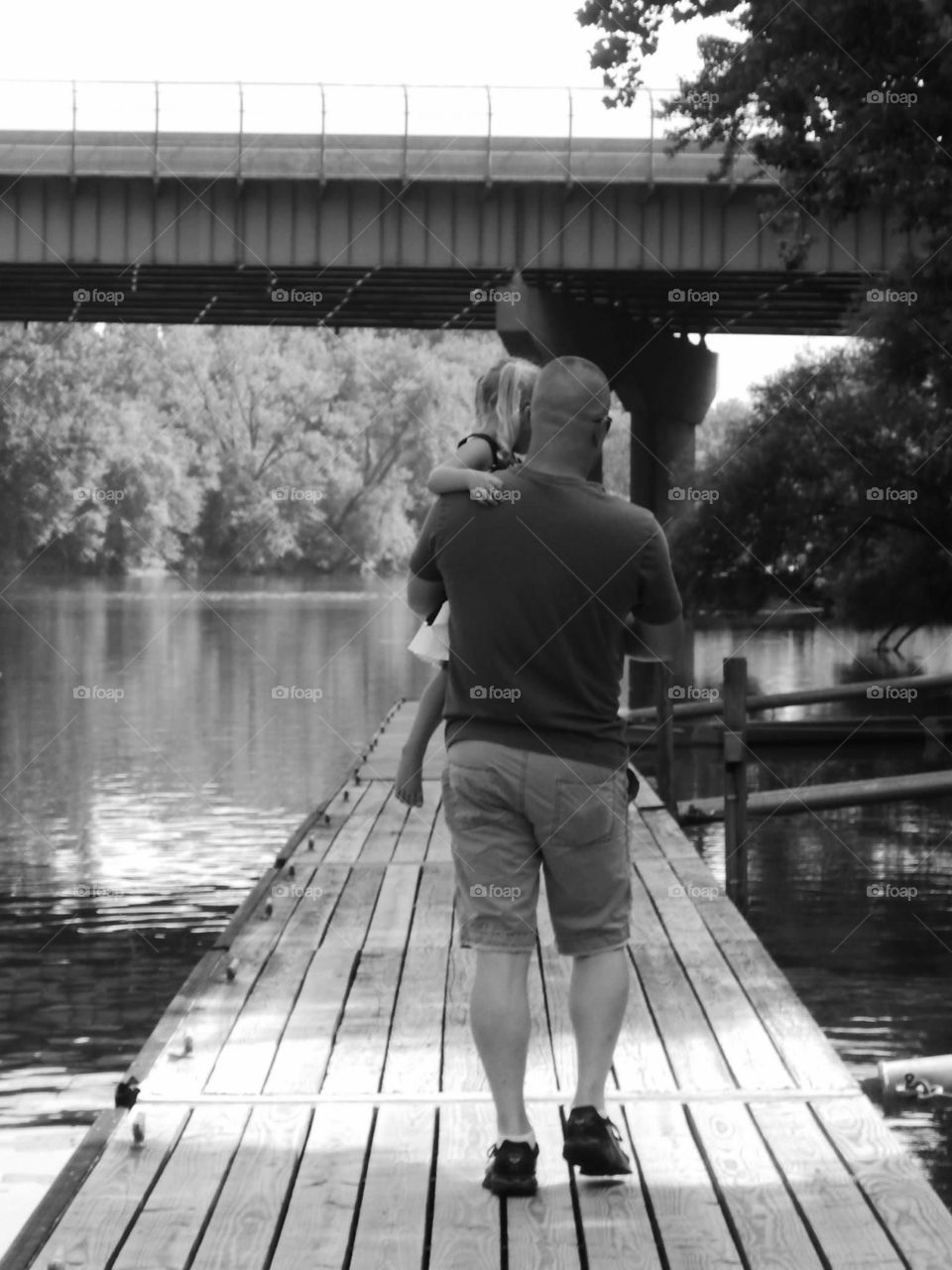 Walking down the dock with daddy. 
