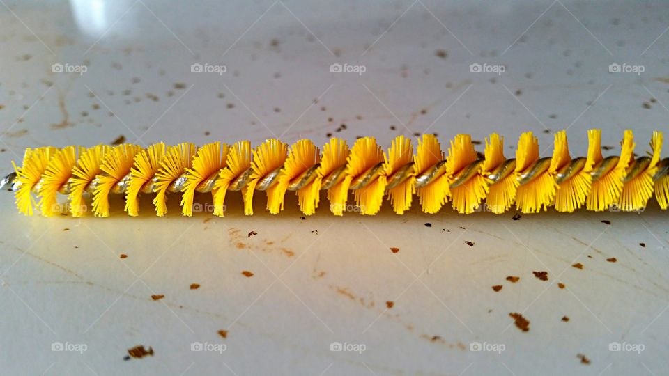 Yellow cleaning brush. Cleaning brush with yellow bristles. 