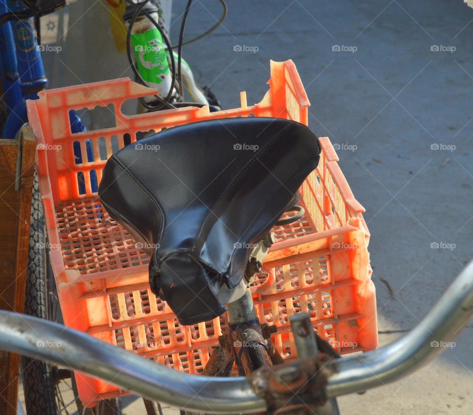 my old but still alive scruffy bike with a plastic basket instead of a trunk