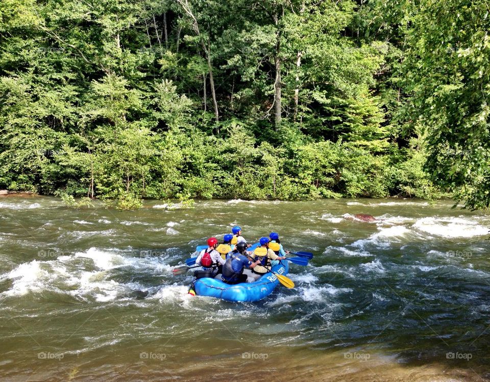 People rafting on river