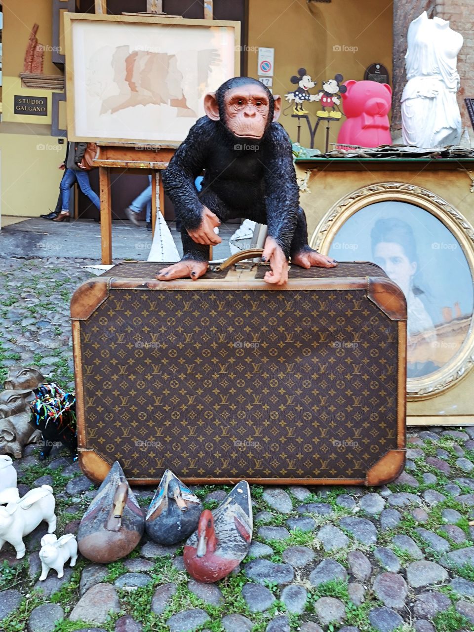 monkey toy on a Louis Vuitton bag