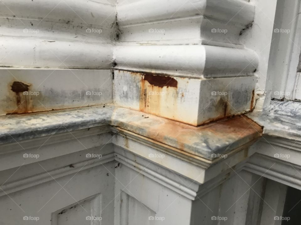 Tatty and rust laden like a discarded old bar of metal. In need of some tender loving care this stately home exterior.