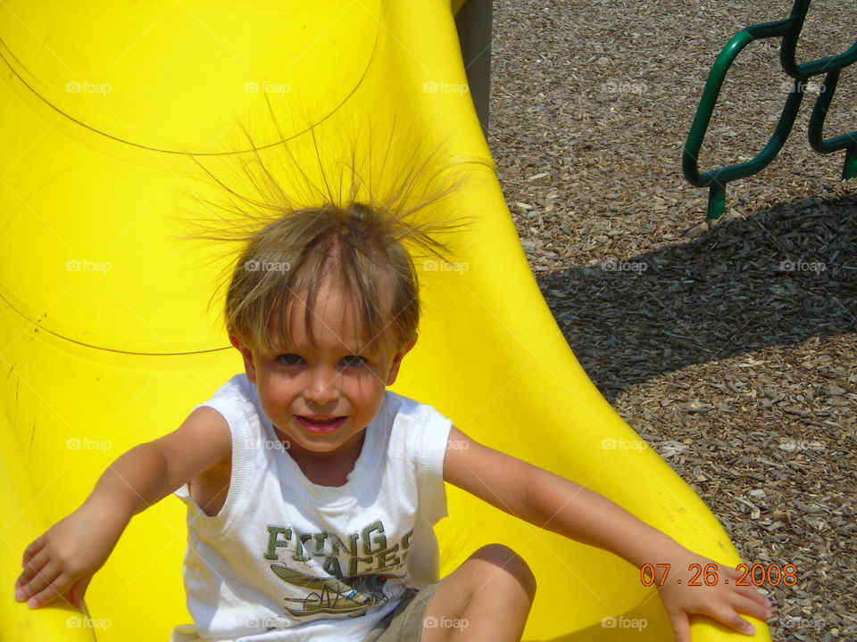 static galore. sliding & playing at the park with friends. lots of static & static shock. My son is unsure what to think of his hair sticking up.
