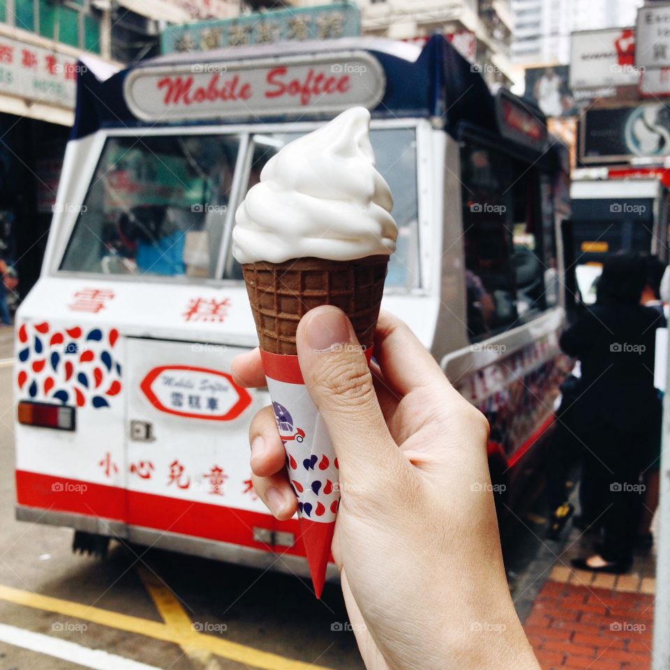Summertime Ice Cream : Hand holding ice cream cone 