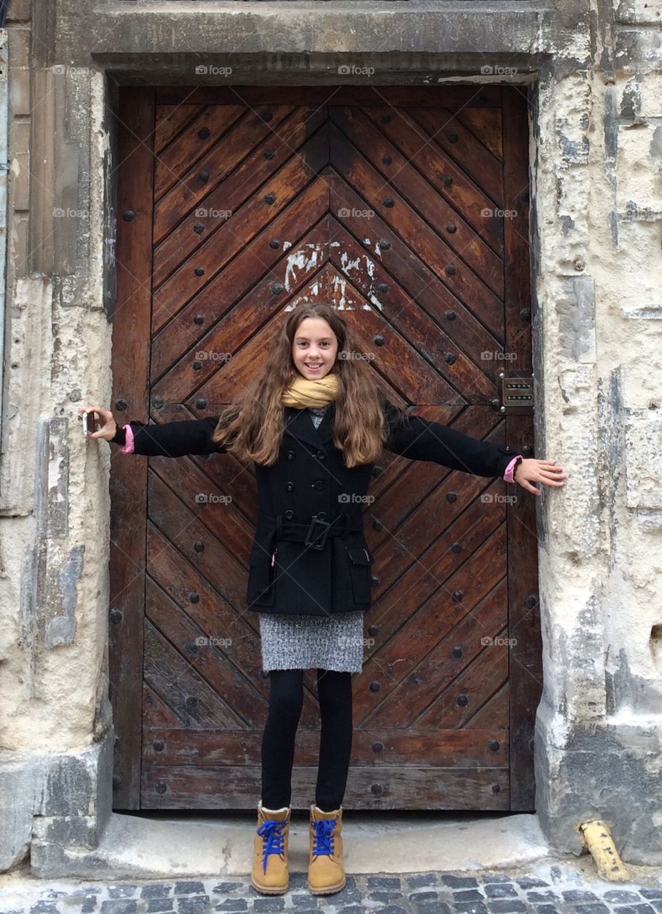 Smiling girl at the door