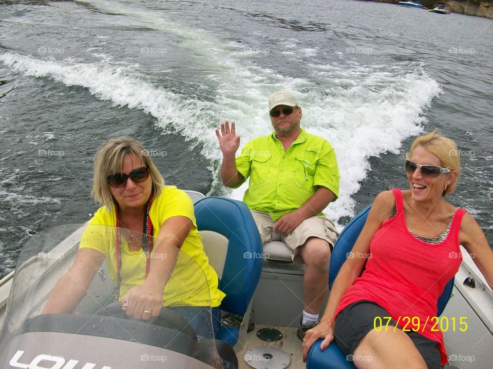 Group of people on motorboat in sea