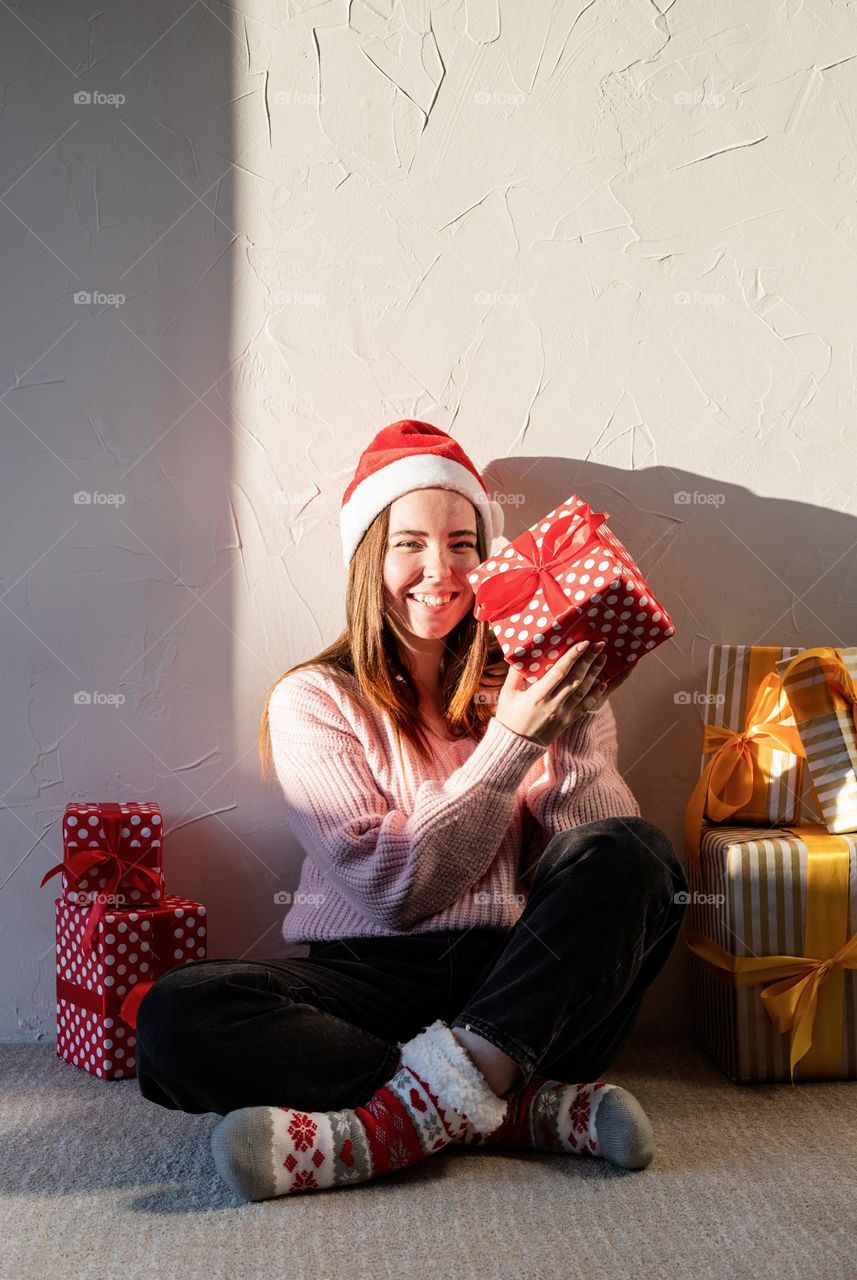 woman holding christmas gifts