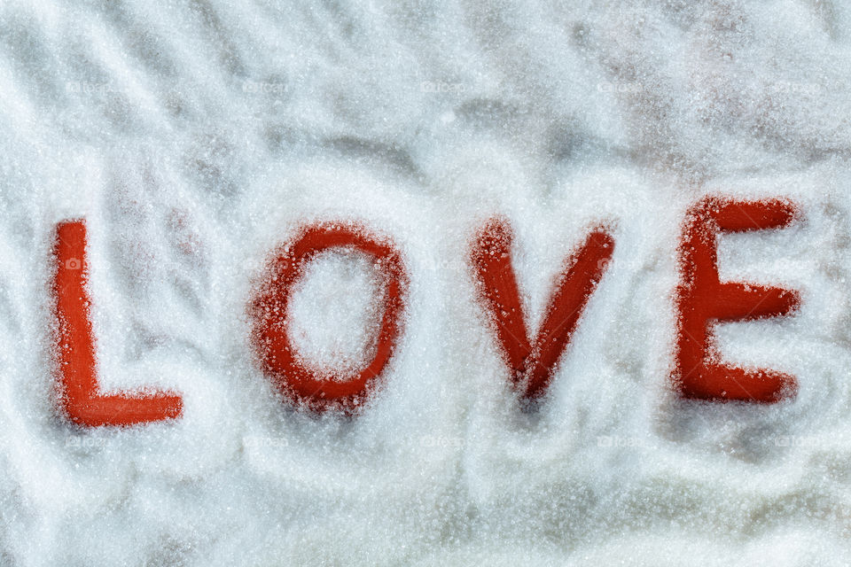 Love writen in white sugar. minimal valentine concept