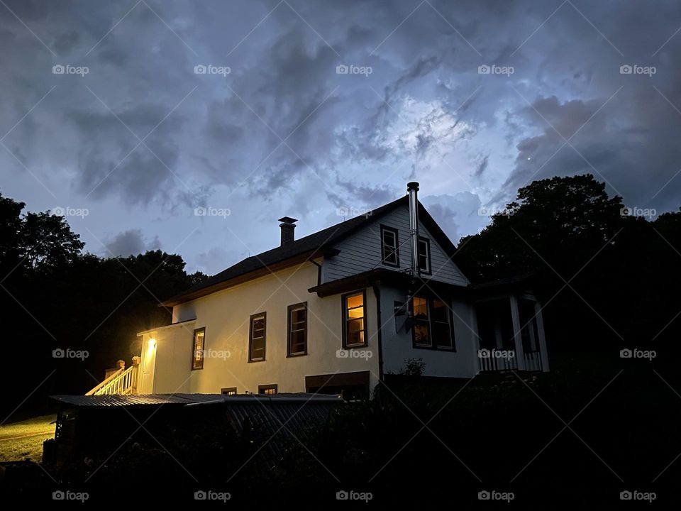 Cozy house under threatening skies