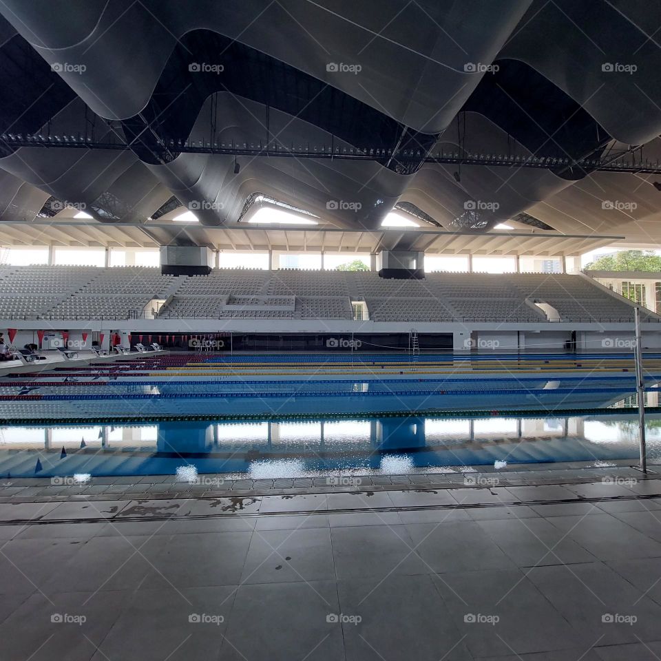 the pool area has been prepared for the swimming competition.  The swimming track has been installed in the pool and the championship is ready to start