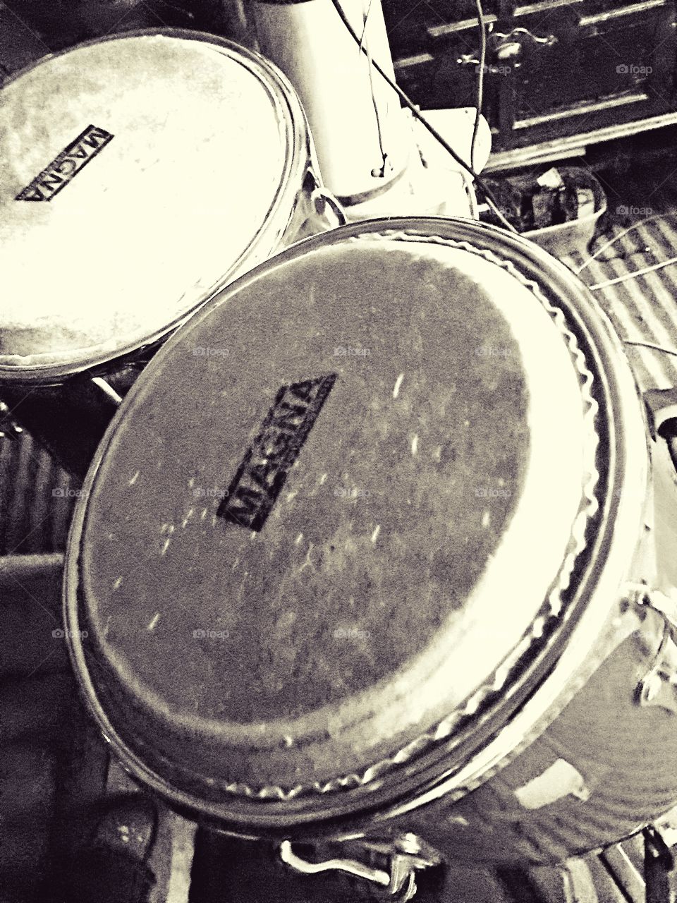 Black and white photo of a set of Magna bongo drums.