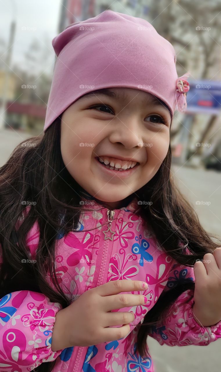 Beautiful little girl in spring portrait