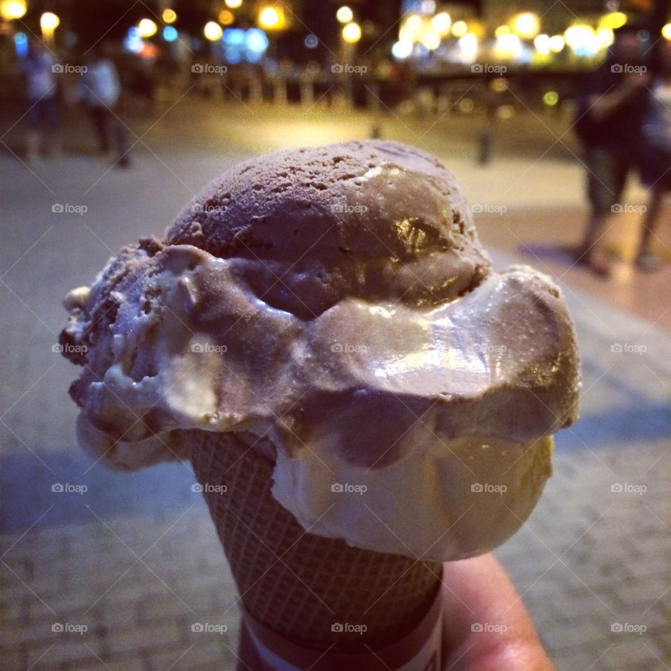 Hand holding ice cream. Eating helado ice cream in Cantabria, Spain