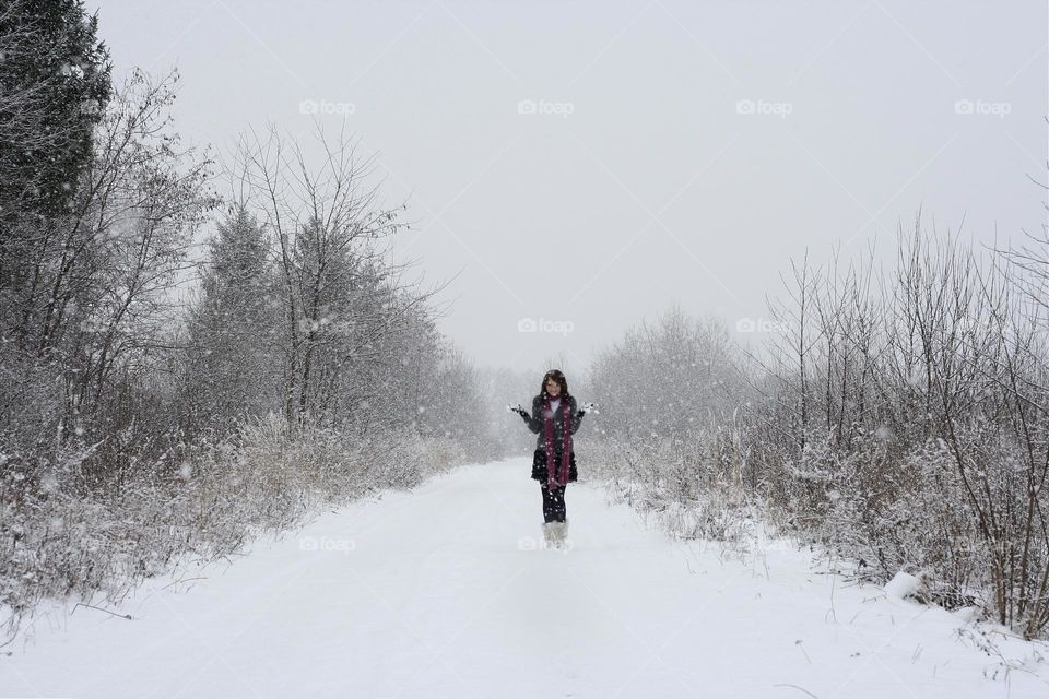 portrait of a girl in a snow-covered field