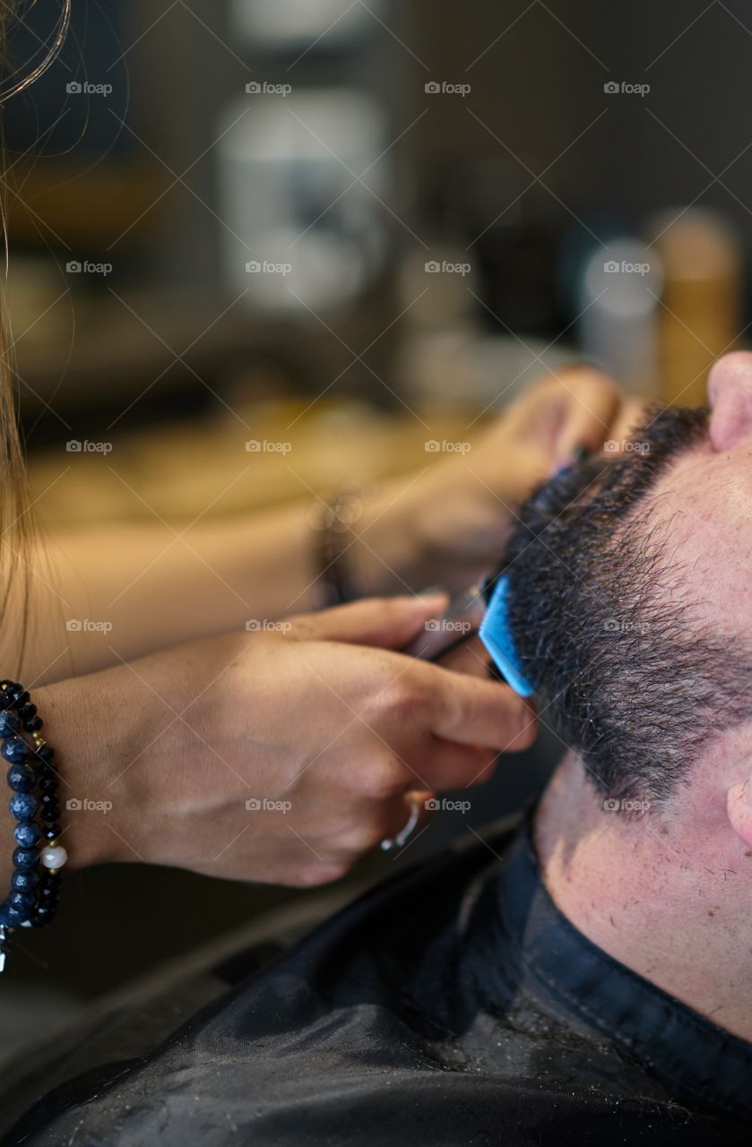 Young man at the barber