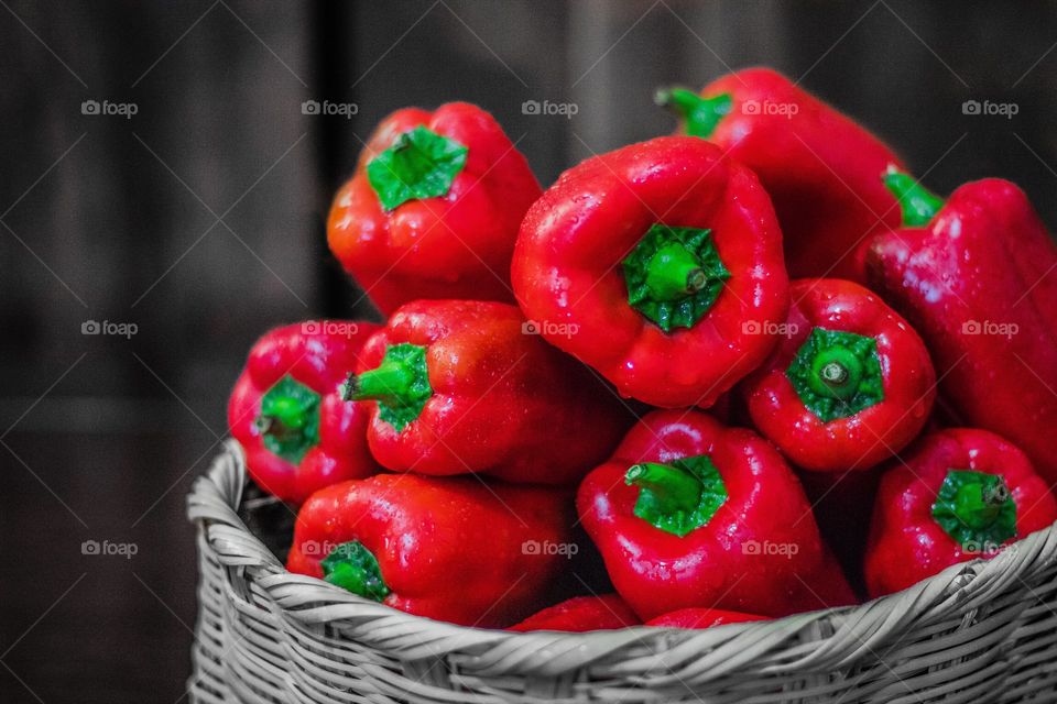 Colorful and bright red peppers on a basket. Healthy, colors, contrast, still life related picture!