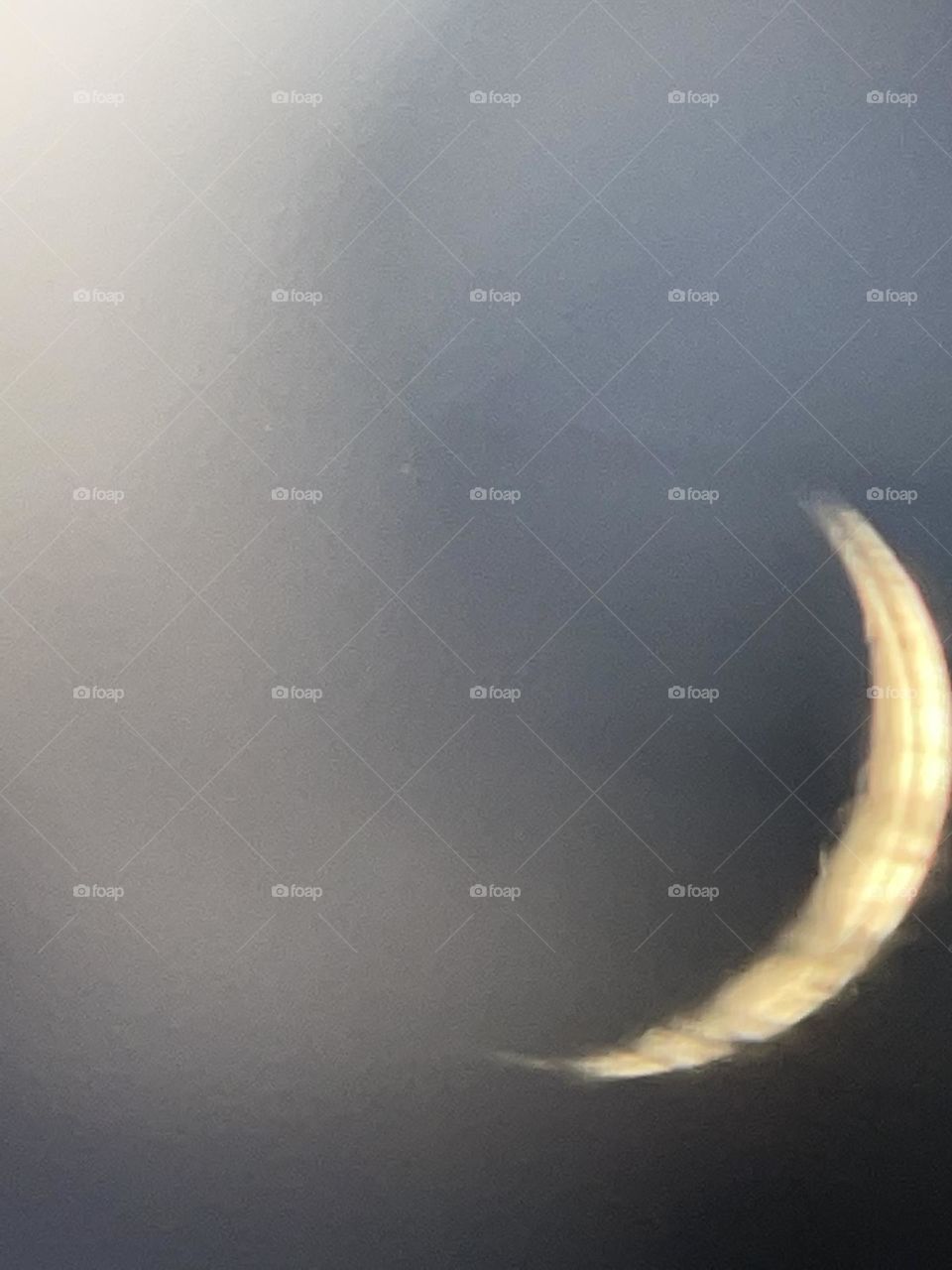 Cloudy skies lit by the moon