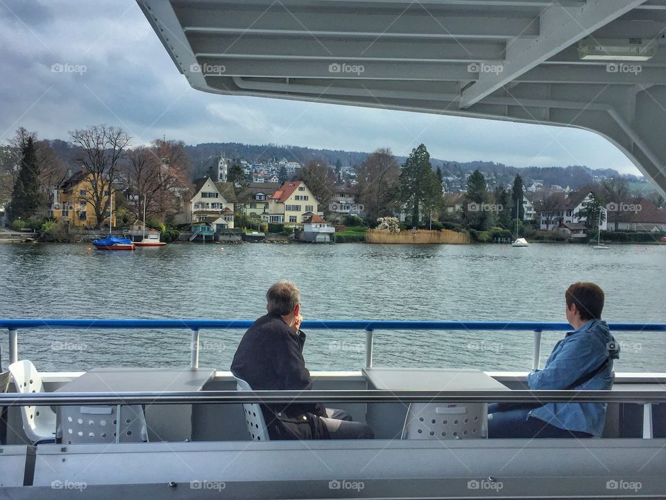 Elderly couple enjoying the boat ride 