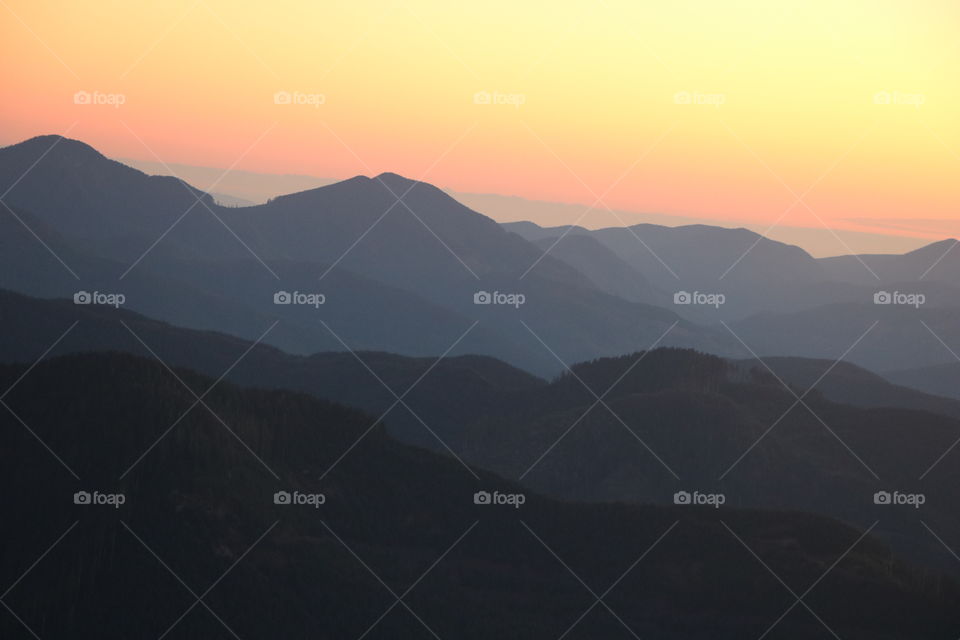 Mountain range at golden hour as seen from above 