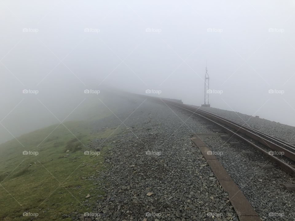 Snowden railway track disappearing into the mist / fog / cloud 