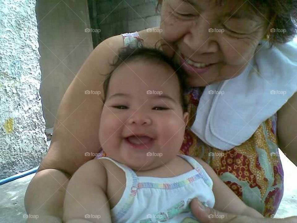 funny and cute baby with grandma