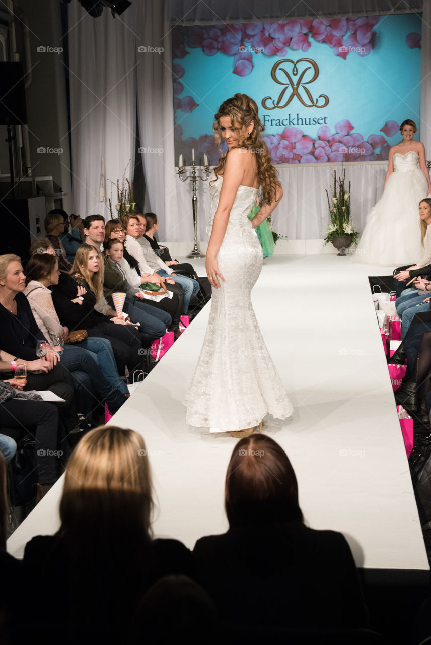 Fashion show at a wedding fair. Here are the latest dresses and clothes for both bride and groom.