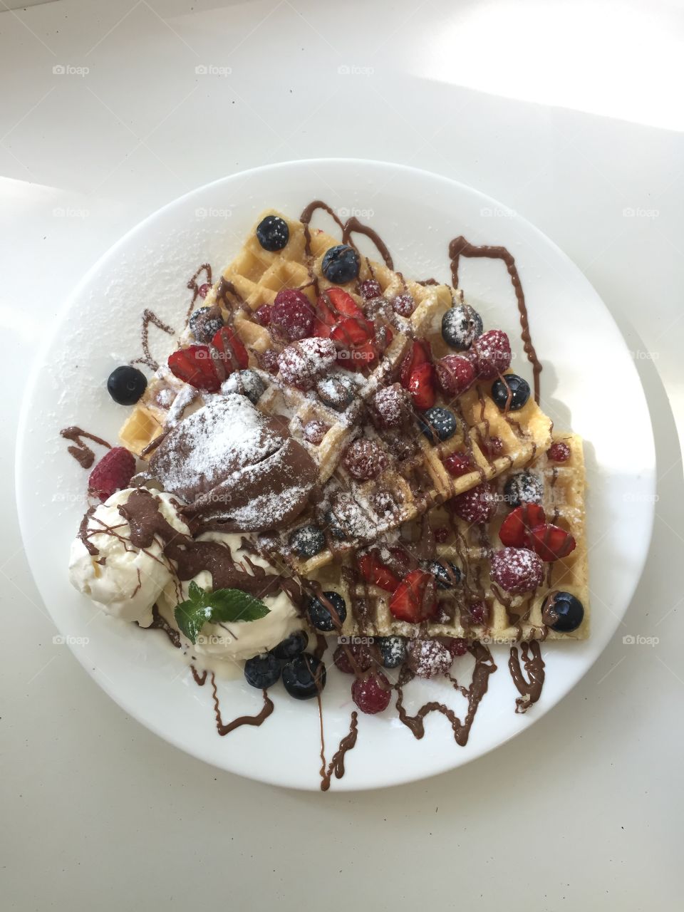 Amazing tasty Belgium waffle with berries