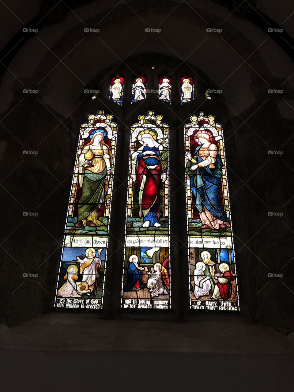 A very splendid stained glass window, on prominent display at St Pancras Church in Widecombe in the Moor, Dartmoor.